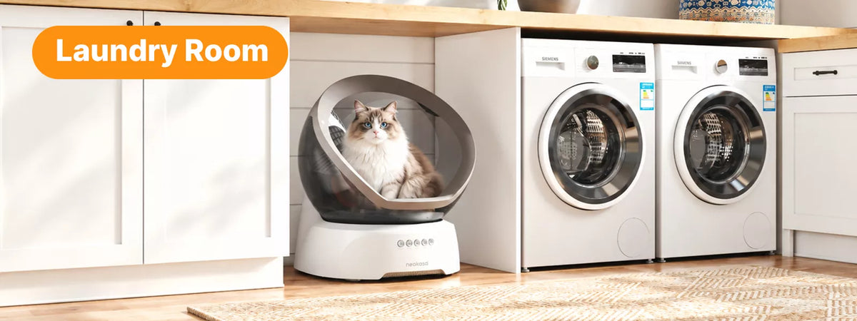 Neakasa M9 automatic cat litter box in alaundry room.