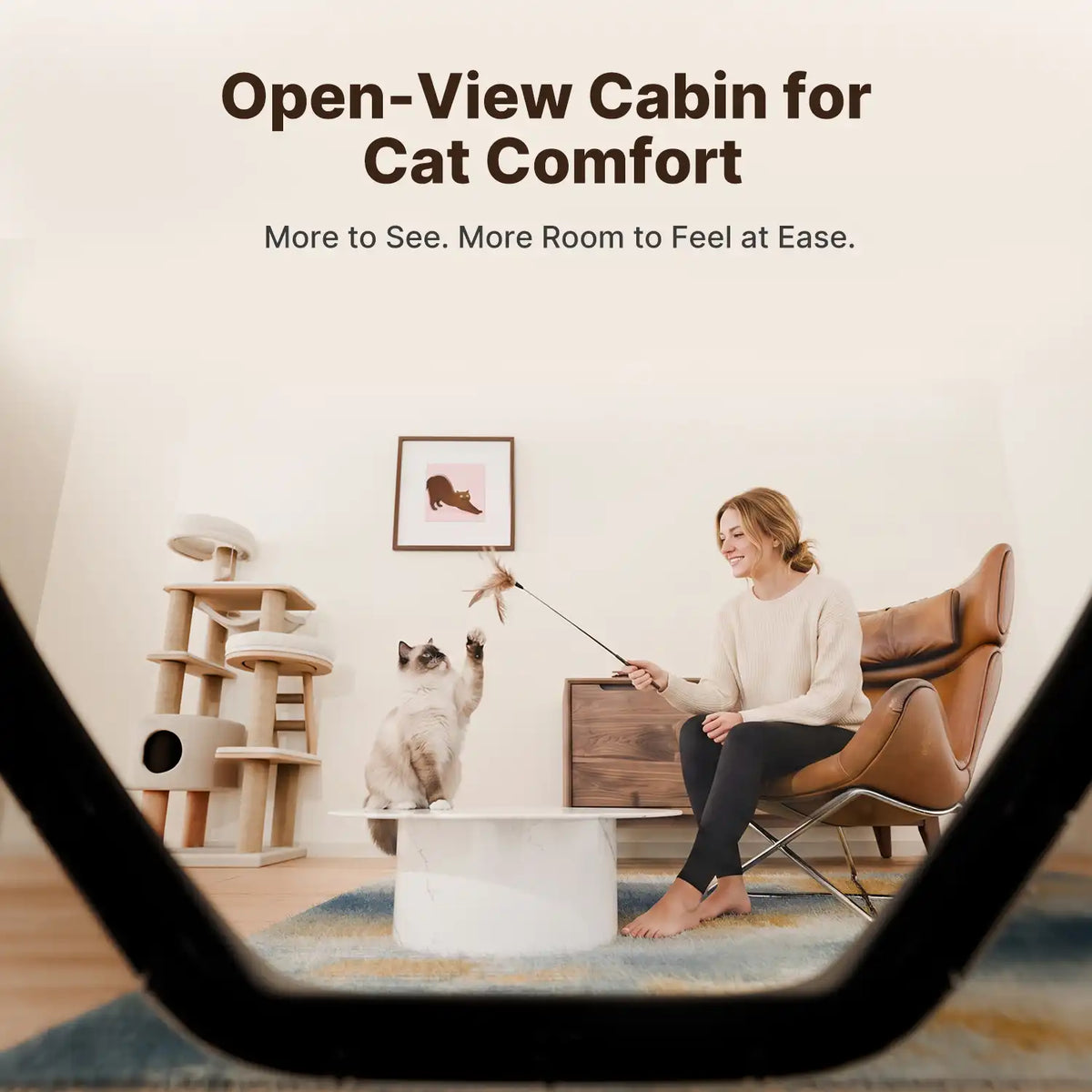 View through the Neakasa M9 litter box’s open-view cabin, showing a cat playing with its owner in the living room.